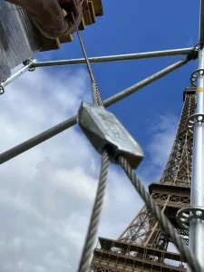 Close-up of FASTLINK Wire Joiner connecting steel wire ropes near the Eiffel Tower in Paris